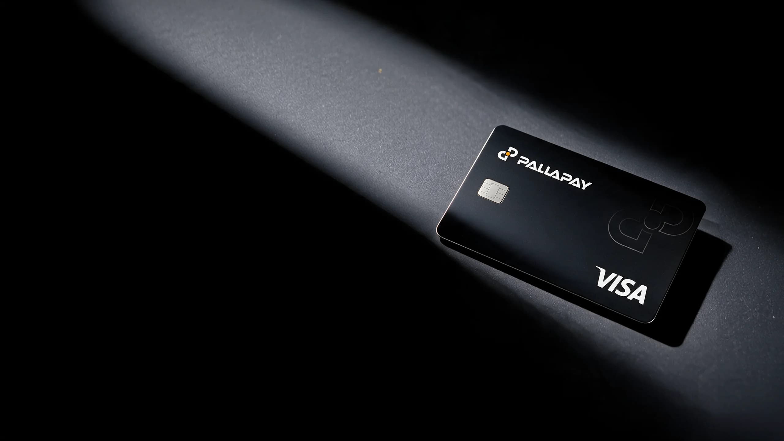 Pallapay Visa crypto card lit by a beam of light